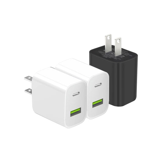 Three USB wall chargers, two white and one black, with green USB ports and visible prongs.