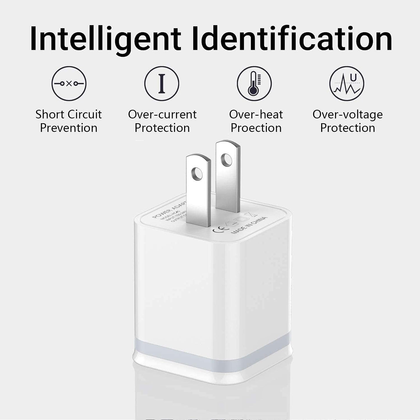 White USB wall charger with metal prongs, featuring icons for protection against electrical faults.