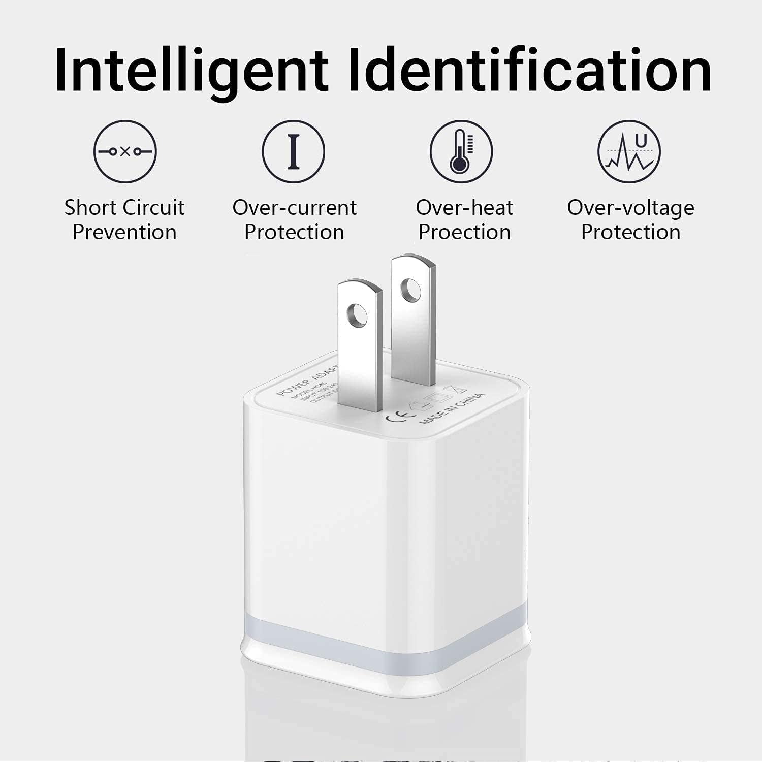 White USB wall charger with metal prongs, featuring icons for protection against electrical faults.